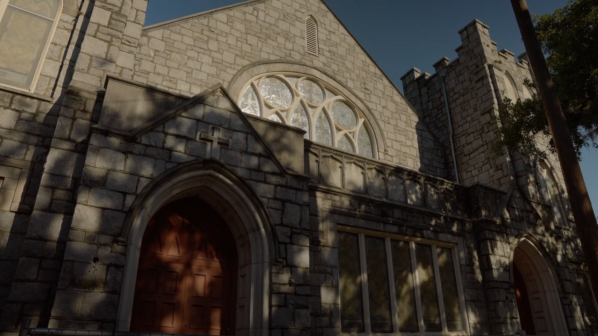 Close exterior view of the historic stone church facade at Starland Village.
